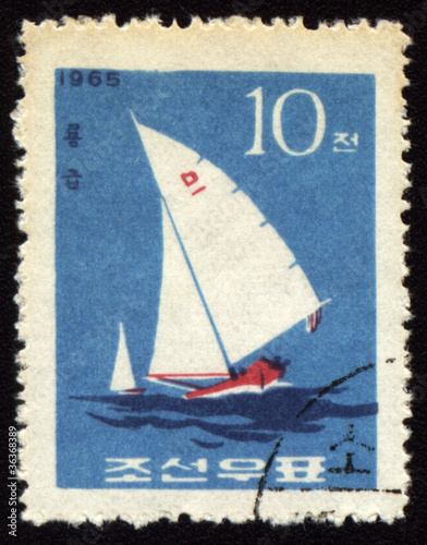 Yacht in a sea on post stamp