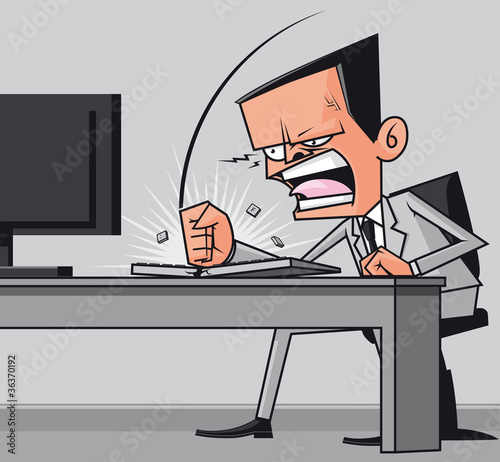 Furious frustated businessman hitting the computer keyboard photo