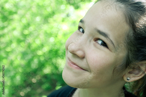 endearing cute girl in the beautiful morning park outdoor