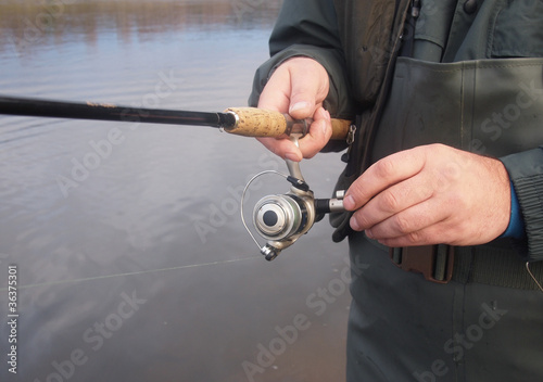 Fisherman with spinning rod