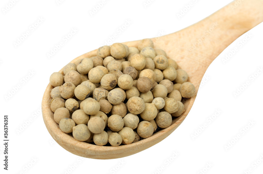 white pepper in a wooden spoon white pepper in a wooden spoon