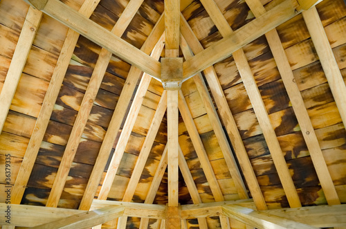 sunlight creeping into a timber roof interior