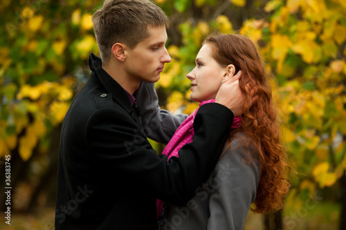 young man lovingly looks at his girlfriend