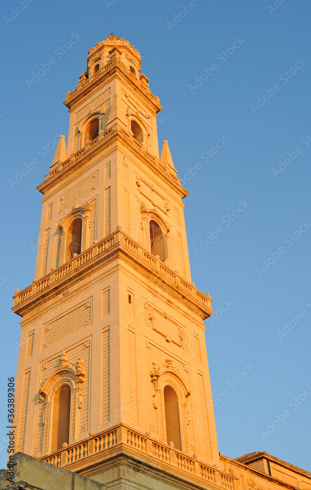Duomo tower against blue sky in Lecce, Italy