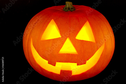 Halloween pumpkin with scary face isolated on black