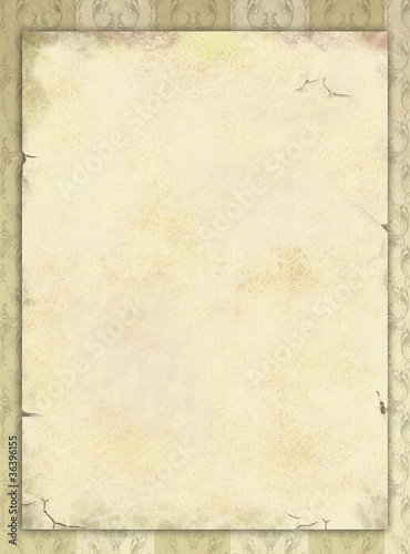 A dusty paper sheet on a vintage wallpaper
