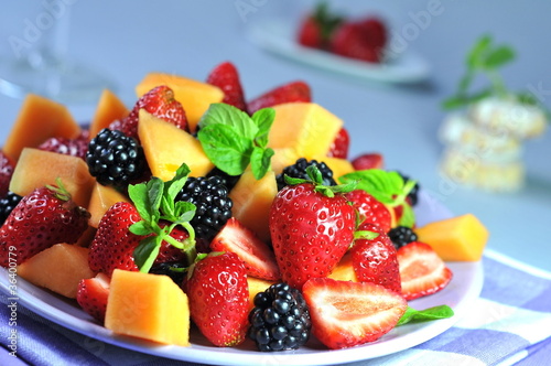 Fruit salad on blue background