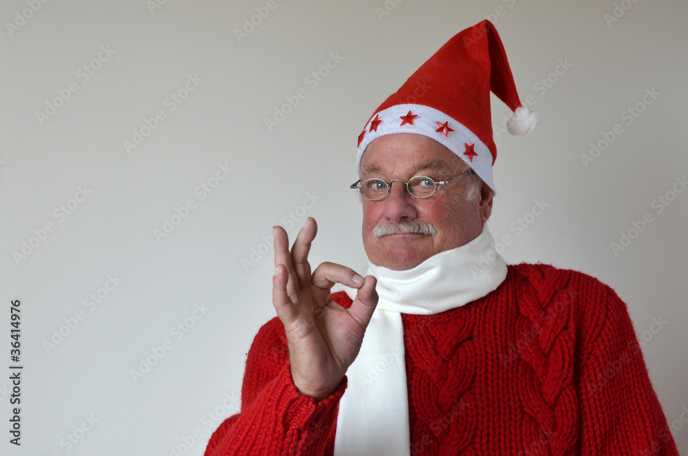 Φωτογραφία Zufriedener Weihnachtsmann zeigt mit Finger