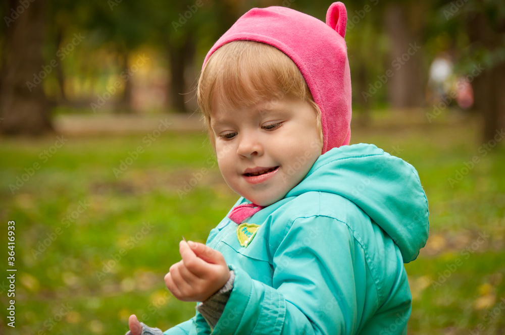 Cute child walking in autumn park Cute child walking in autumn park