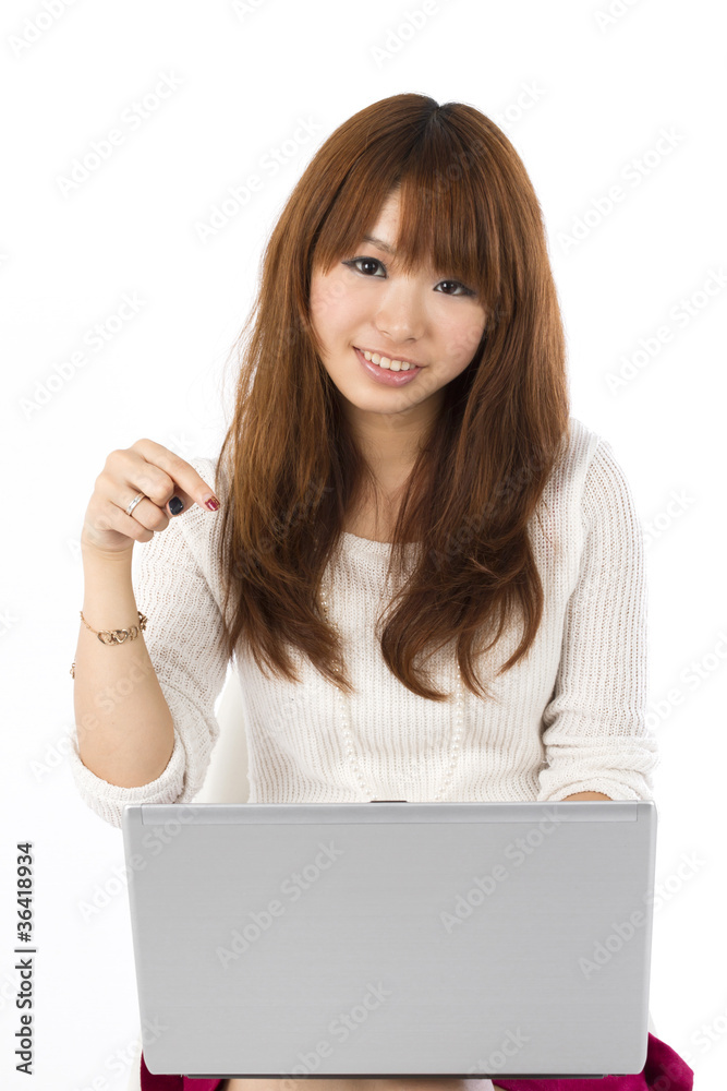 Beautiful asian woman using a laptop computer Beautiful asian woman using a laptop computer