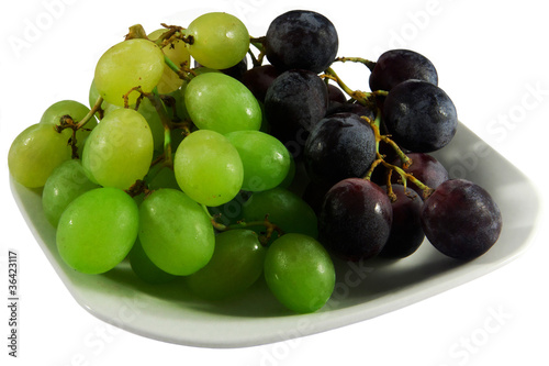 Plate of black and white grapes