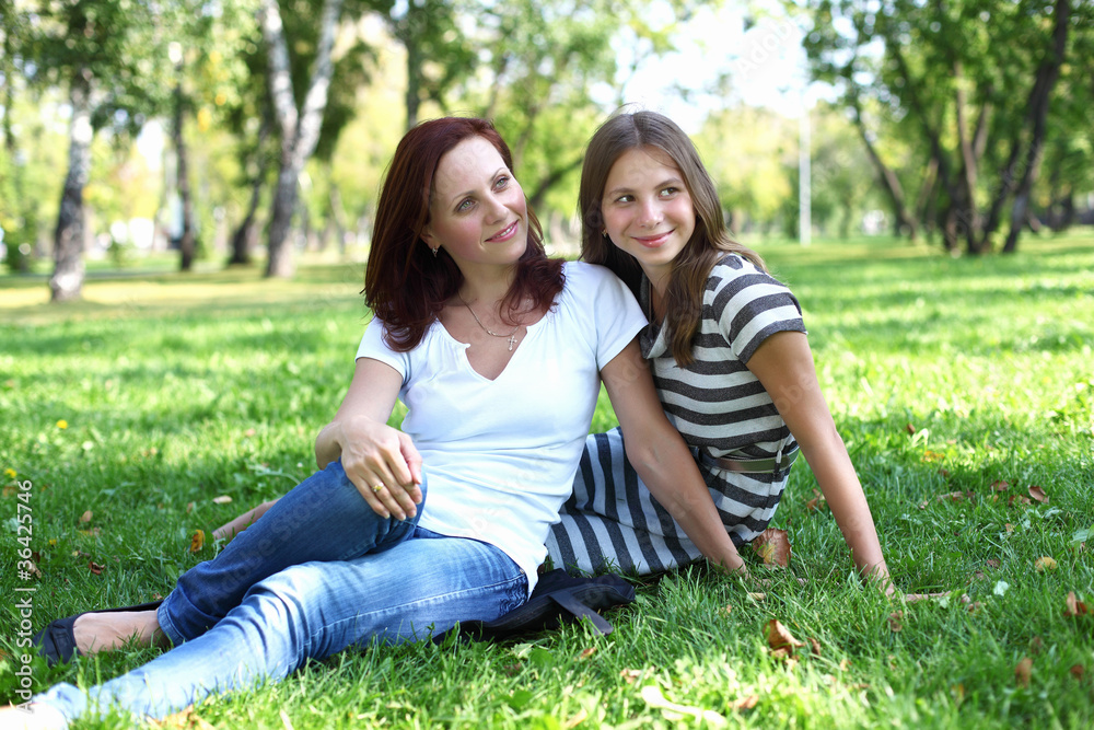 Mother with her daughter in summer park Mother with her daughter in summer park