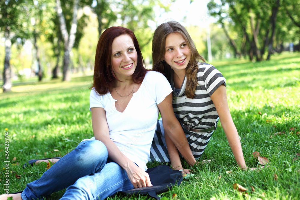 Mother with her daughter in summer park Mother with her daughter in summer park