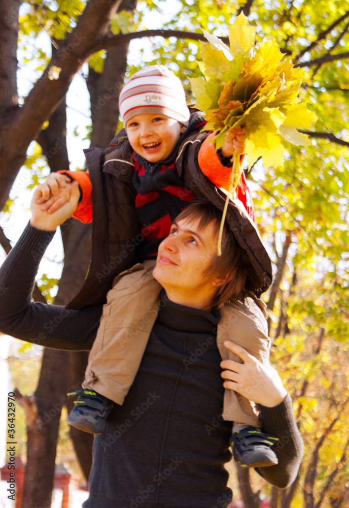Happy father and son at fall time