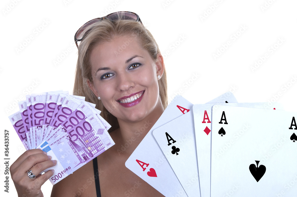 Blond Female model smiling while holding a poker hand of four ac Blond Female model smiling while holding a poker hand of four ac