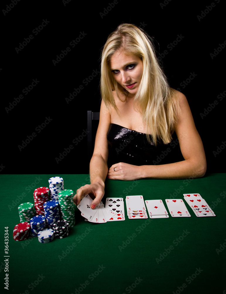 Attractive blond woman playing poker Attractive blond woman playing poker