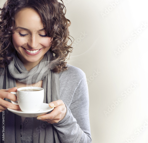 Beautiful Woman with cup of Tea or Coffee