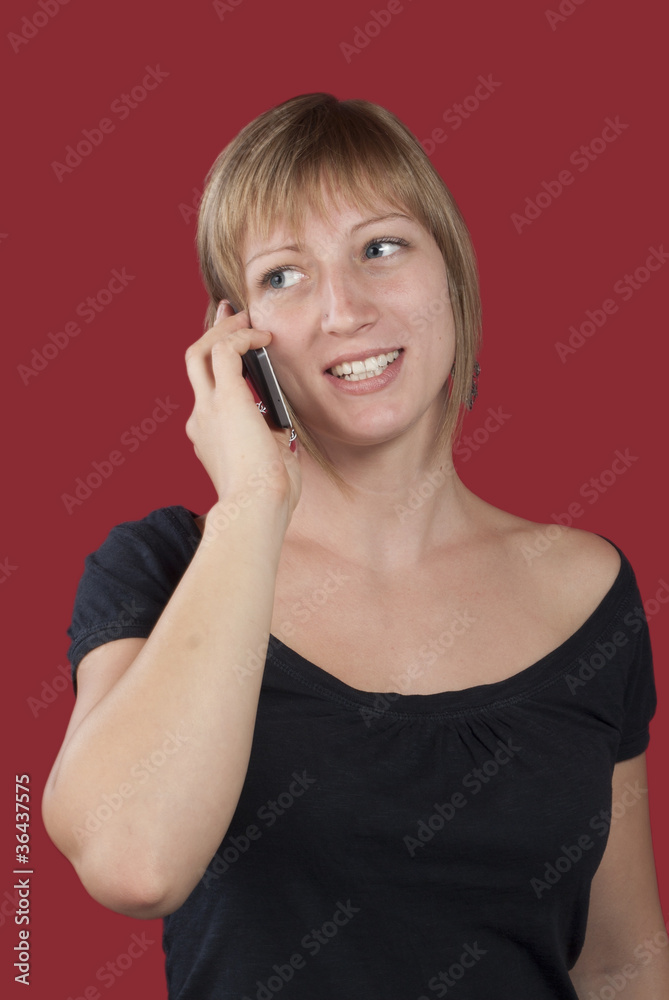 Happy young women talking on mobile phone Happy young women talking on mobile phone