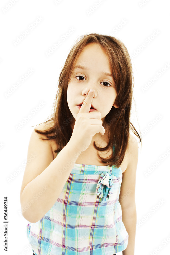shh. secret - Young girl with her finger over her mouth shh. secret - Young girl with her finger over her mouth