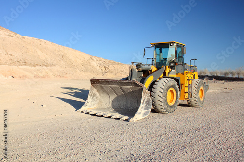Front view of loader machine at the construction zone