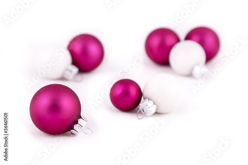Pink and white christmas decorations on a white background