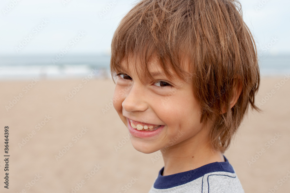 closeup portrait of smiling boy at the beach closeup portrait of smiling boy at the beach