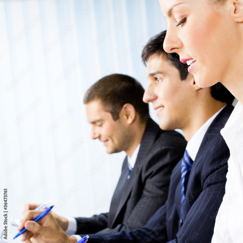 Businesspeople at meeting, presentation or conference Businesspeople at meeting, presentation or conference