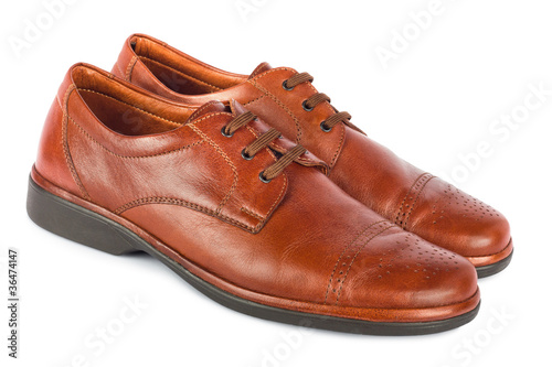 The brown elegant men's shoes on the white isolated background