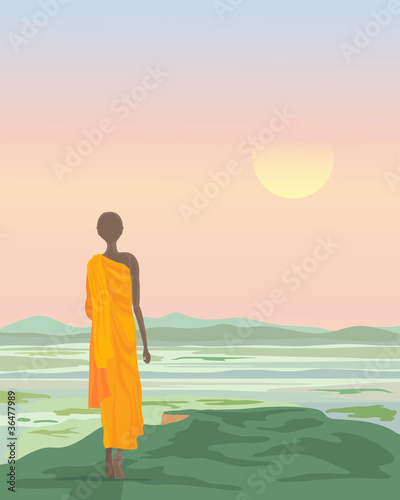 buddhist monk at sunset
