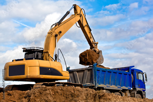 Wallpaper Mural Backhoe loading a dump truck Torontodigital.ca