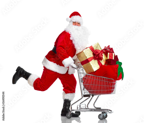 Santa Claus with gifts and shopping trolley. © grinny