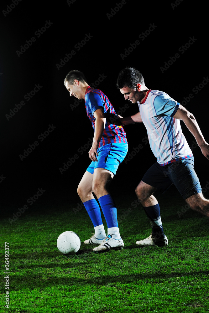 football players in competition for the ball