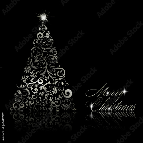 Christmas tree with swirls and floral elements on black backgrou