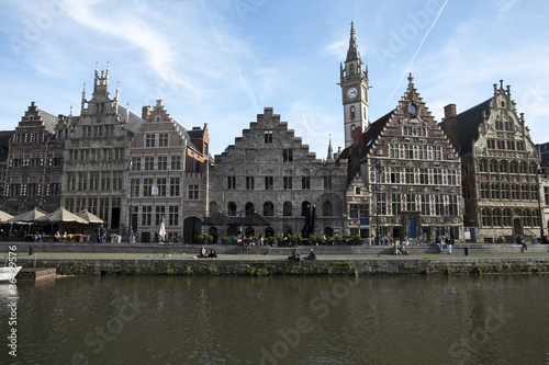 Houses of the Graslei in Belgiums city Gand reflect in the water