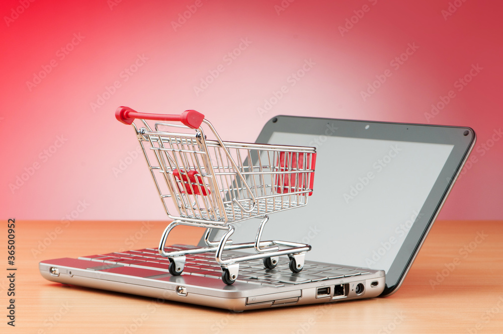 Internet online shopping concept with computer and cart