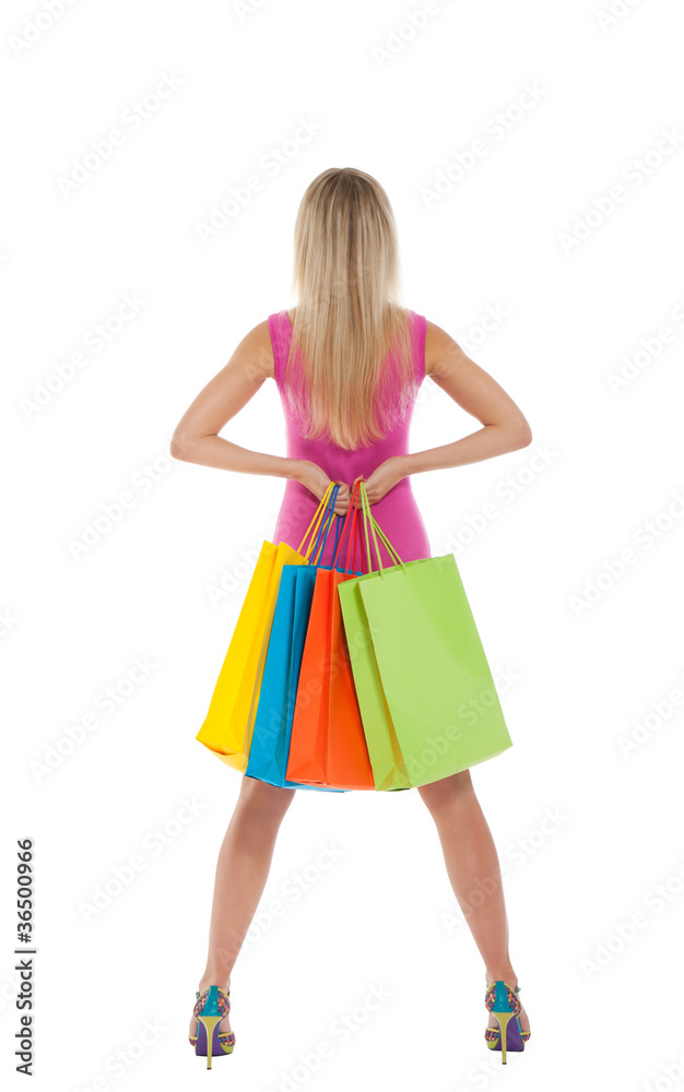 Rear view beautiful woman standing back with shopping bags Rear view beautiful woman standing back with shopping bags