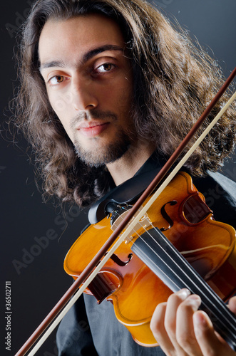 Violin player playing the intstrument photo