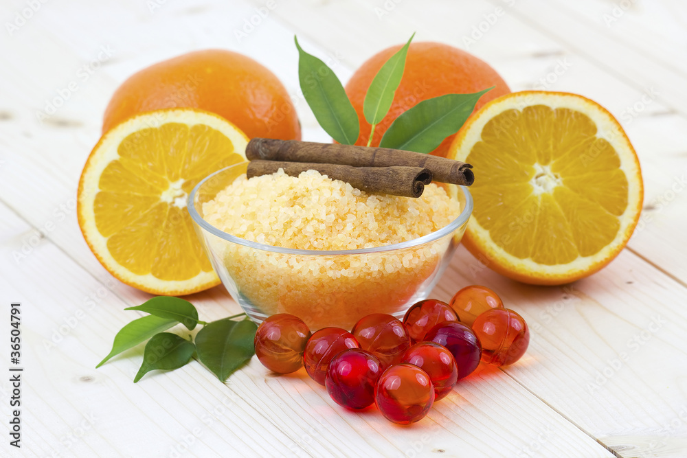bowl of orange bath salt with fresh fruits - beauty treatment bowl of orange bath salt with fresh fruits - beauty treatment