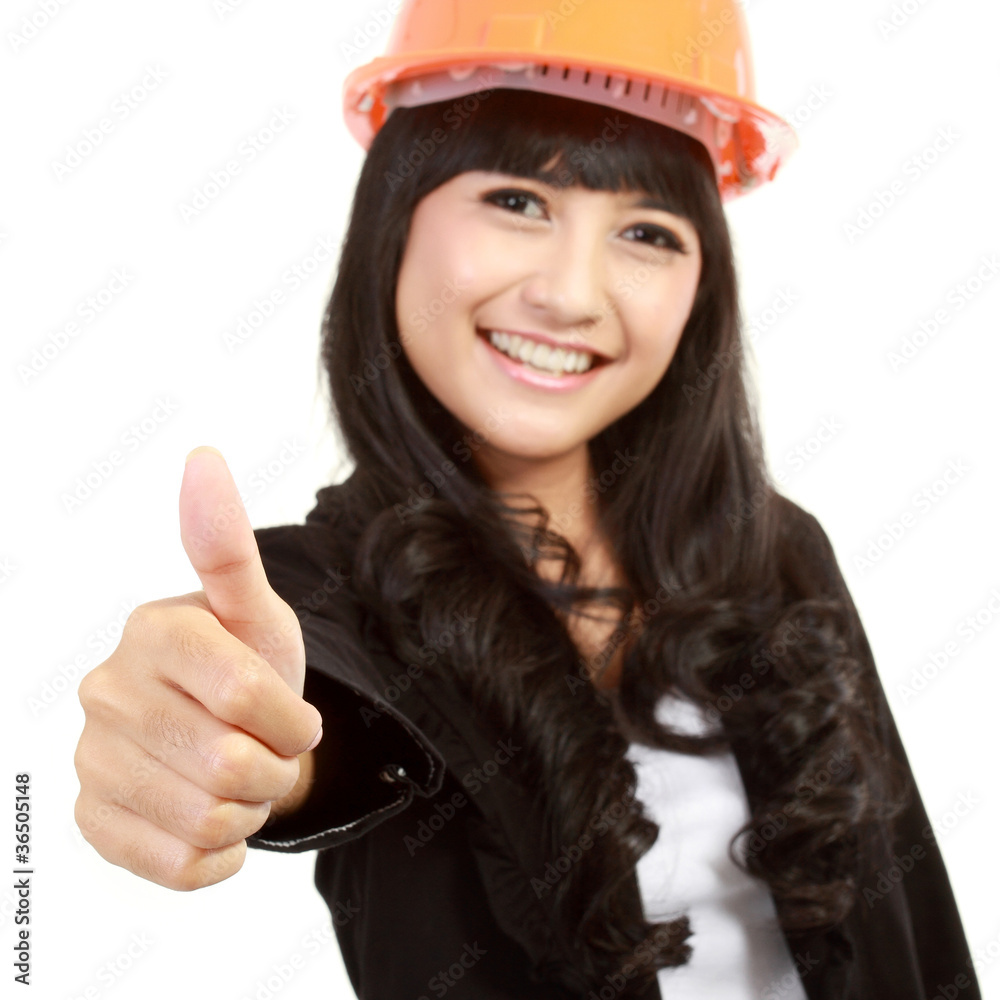 young architect with yellow helmet showing thumb up young architect with yellow helmet showing thumb up
