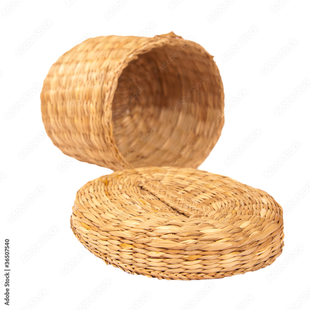 Handmade braided basket with a lid isolated