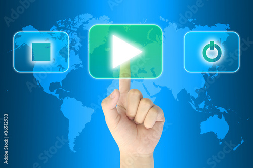 hand pushing media player technology button