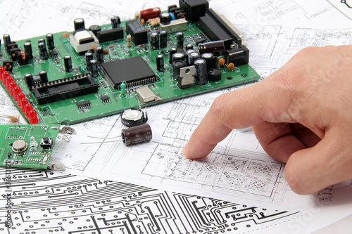 Electronic circuit boards on the background of electronic scheme photo
