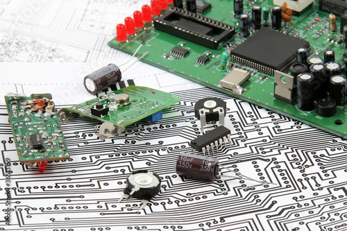 Electronic circuit boards on the background of electronic scheme
