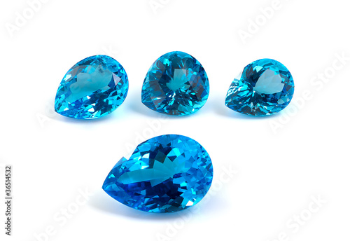 Group of topaz gemstones isolated on white.