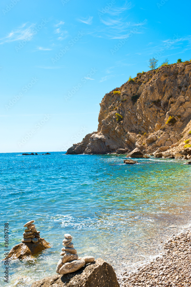 Bright view of calm wild beach of spanish coast line. Clean Medi