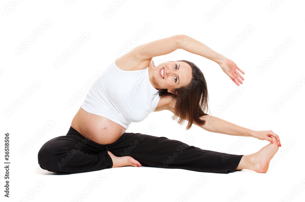 pregnant woman doing stretching gymnastic pregnant woman doing stretching gymnastic