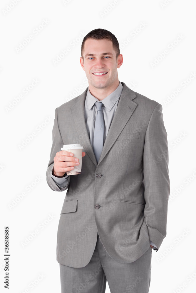 Portrait of a young businessman holding a cup of tea Portrait of a young businessman holding a cup of tea