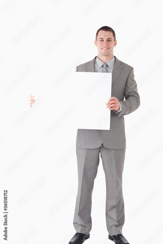 Portrait of a smiling businessman showing a blank panel Portrait of a smiling businessman showing a blank panel