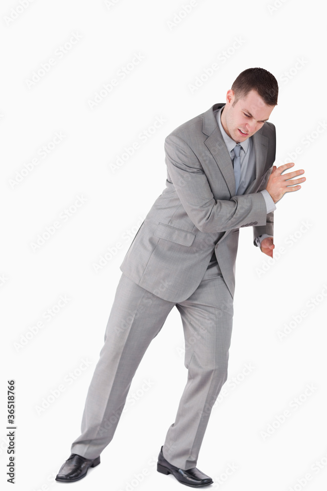 Portrait of a handsome businessman pushing a wall Portrait of a handsome businessman pushing a wall