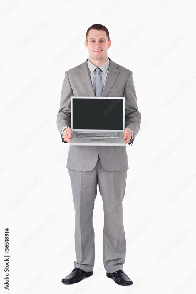 Portrait of a businessman holding a laptop